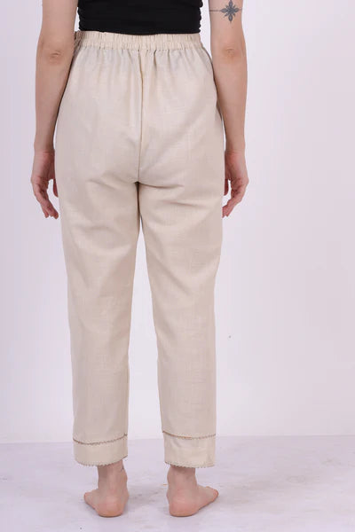 A woman wearing Beige Colored Keengri Pants.