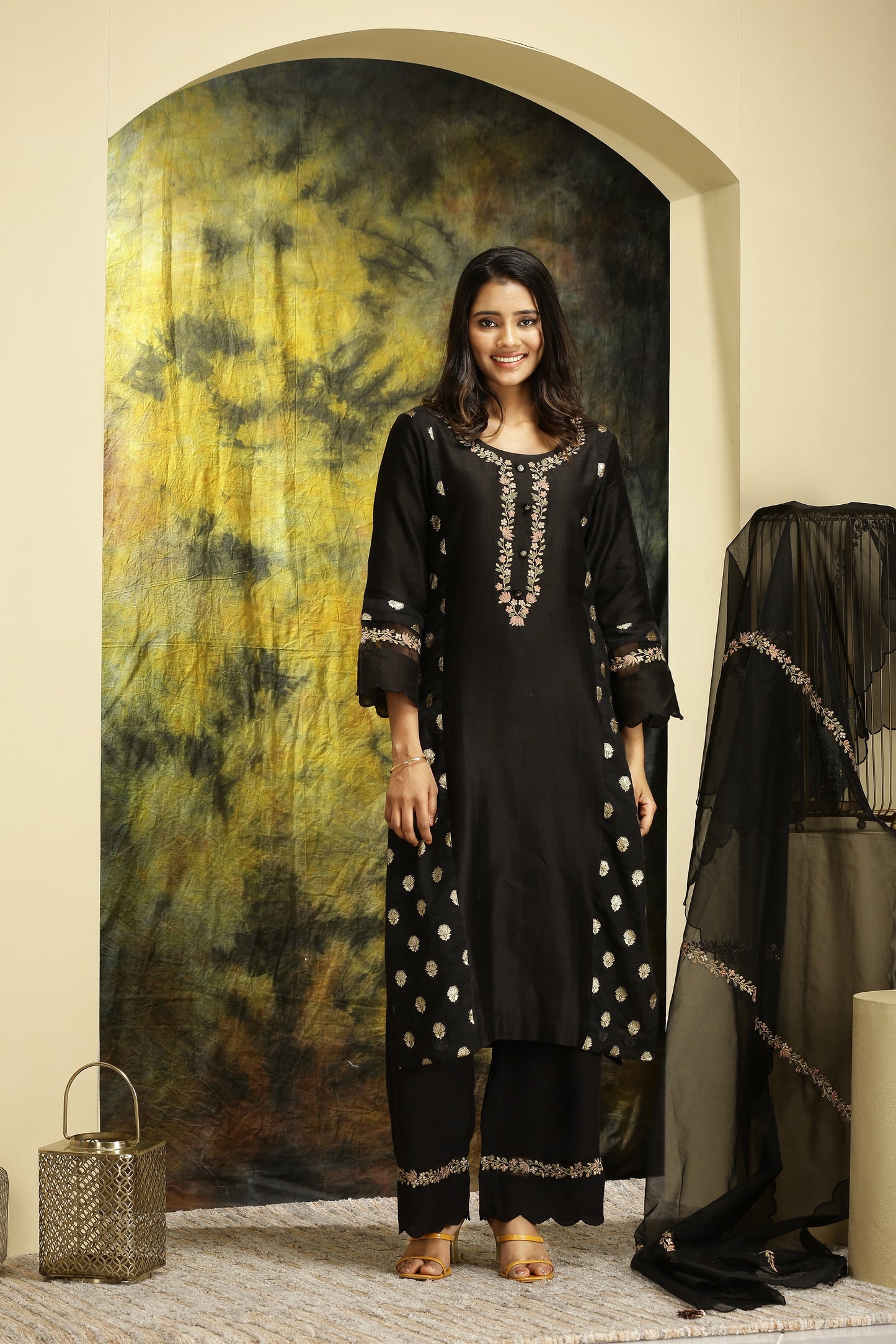 A woman wearing Meenakshi Collection Black Colored Suit Set.