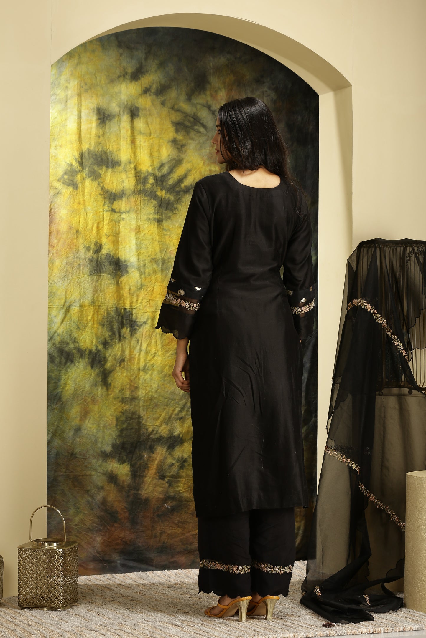 A woman wearing Meenakshi Collection Black Colored Suit Set.