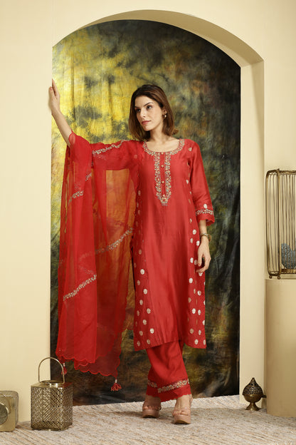  A woman wearing Meenakshi Collection Red Colored Suit Set.