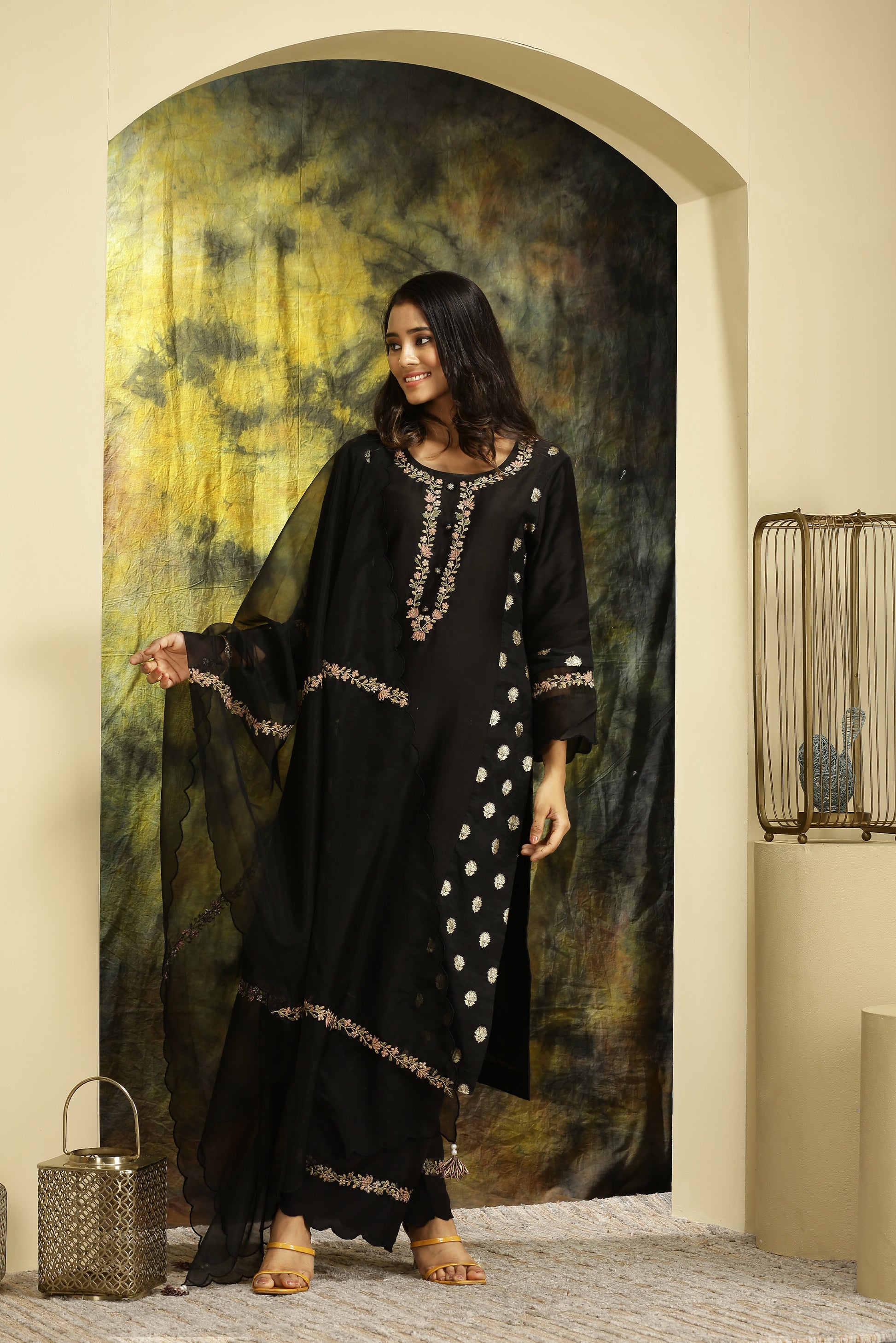 A woman wearing Meenakshi Collection Black Colored Suit Set.